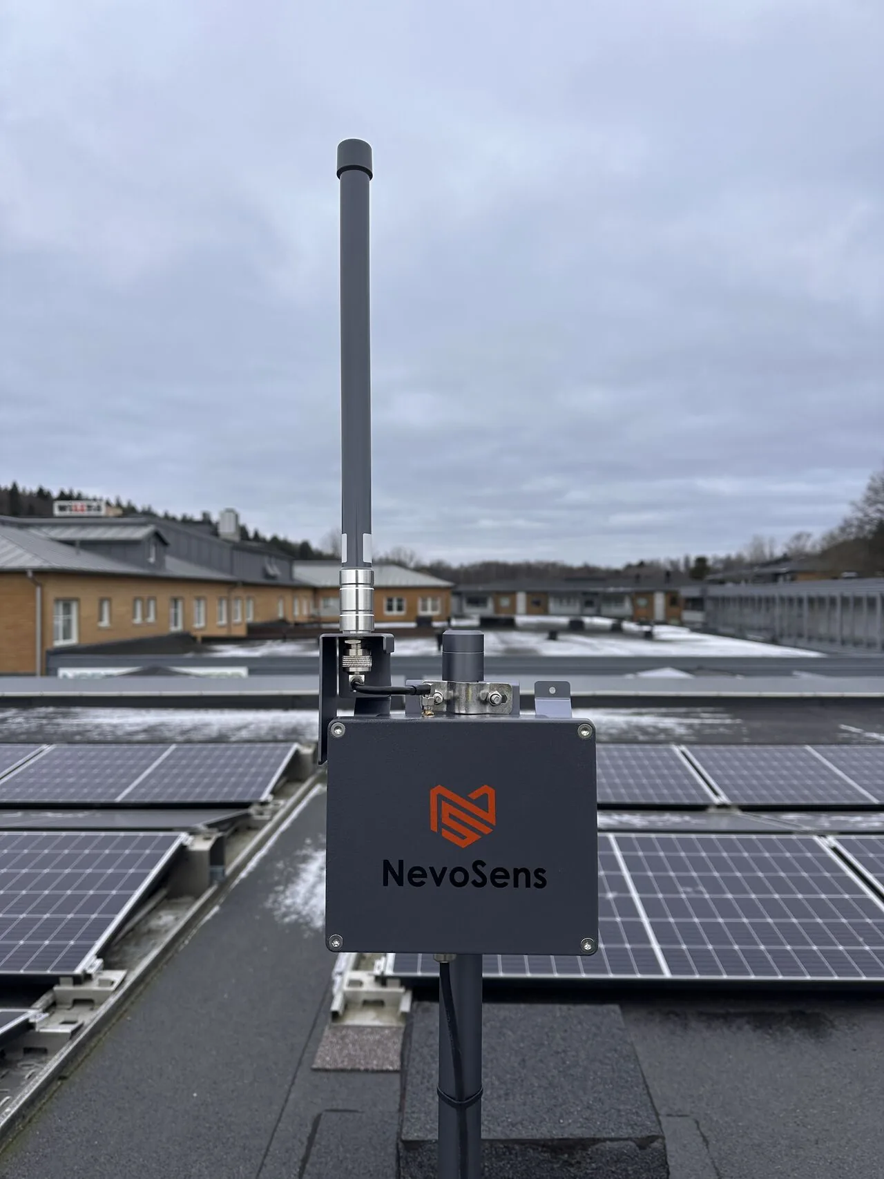 NevoSens gateway and antenna for wireless transmission of snow load data on a roof at an ICA property in Gothenburg